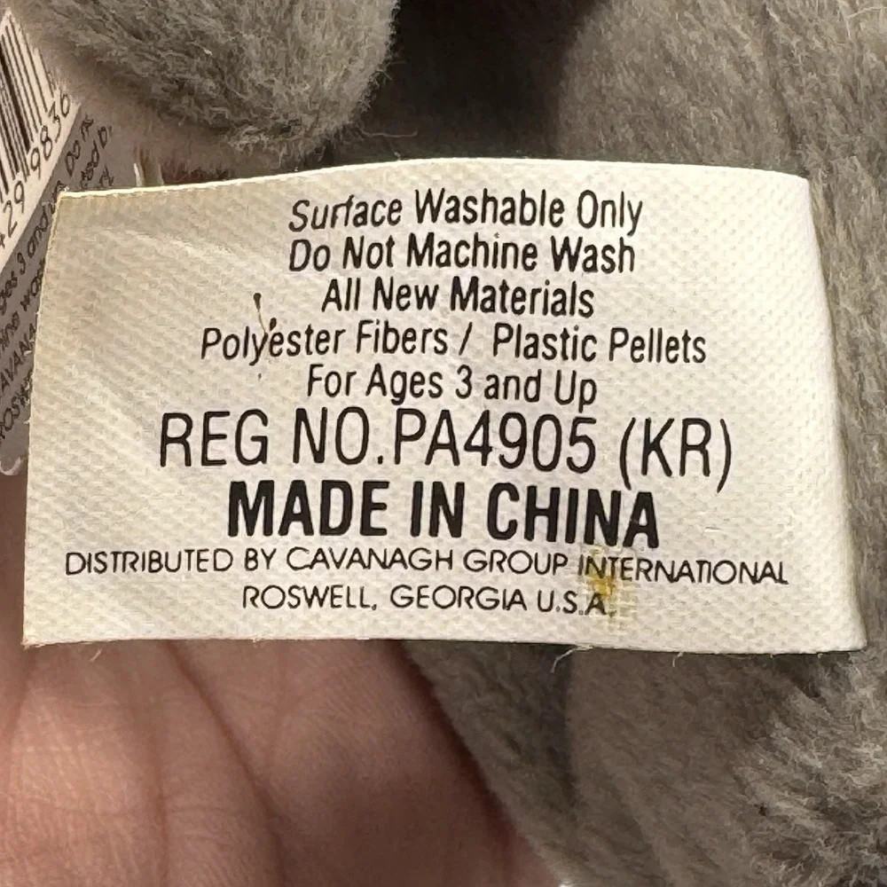 Coca-Cola collectible bean‎ bag plush seal from 1998, wearing a delivery outfit